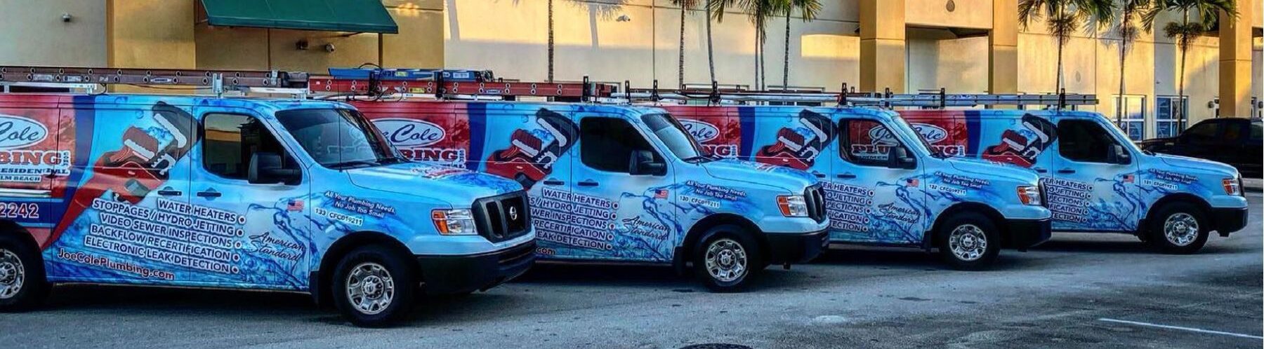 joe cole vans parked outside of their company location ready to provide plumbing services