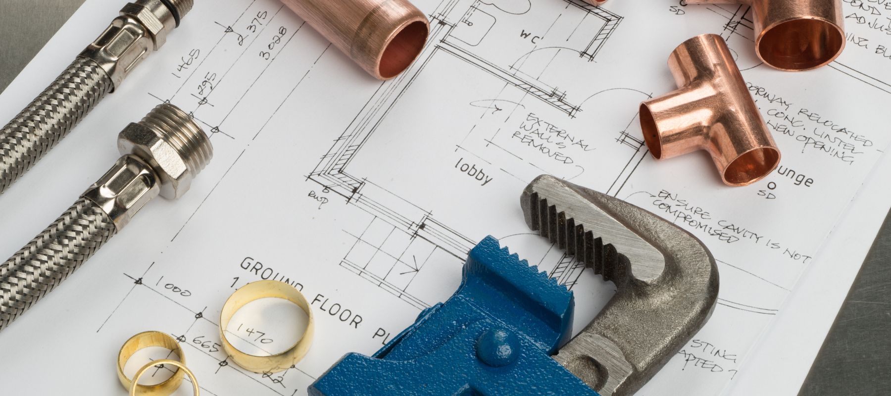blue prints with various tools on top of it