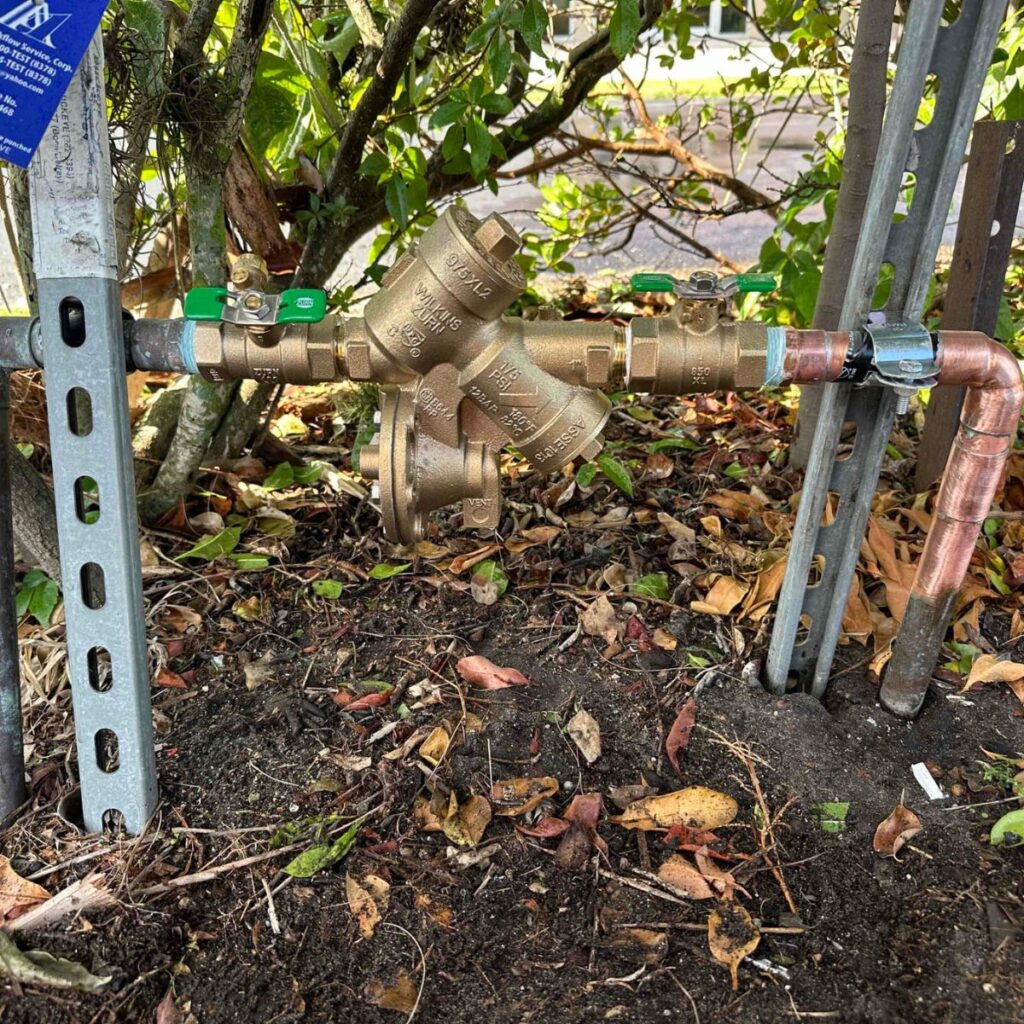 Outdoor backflow preventer assembly with copper piping and brass fittings