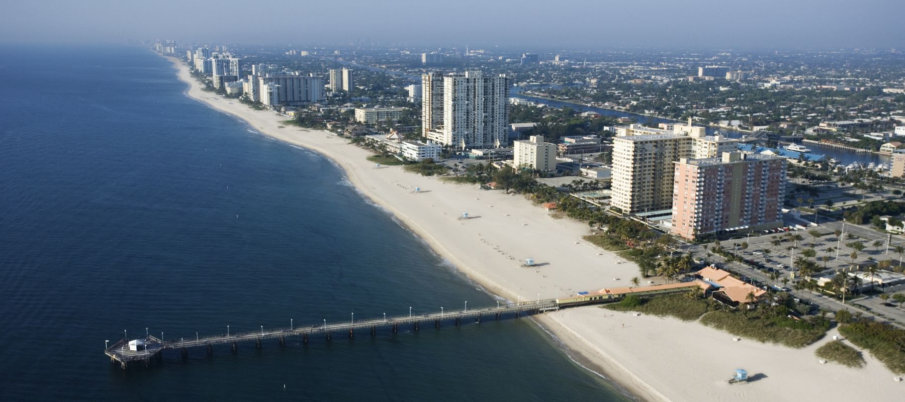 pompano beach coastline with tall buildings near bridge