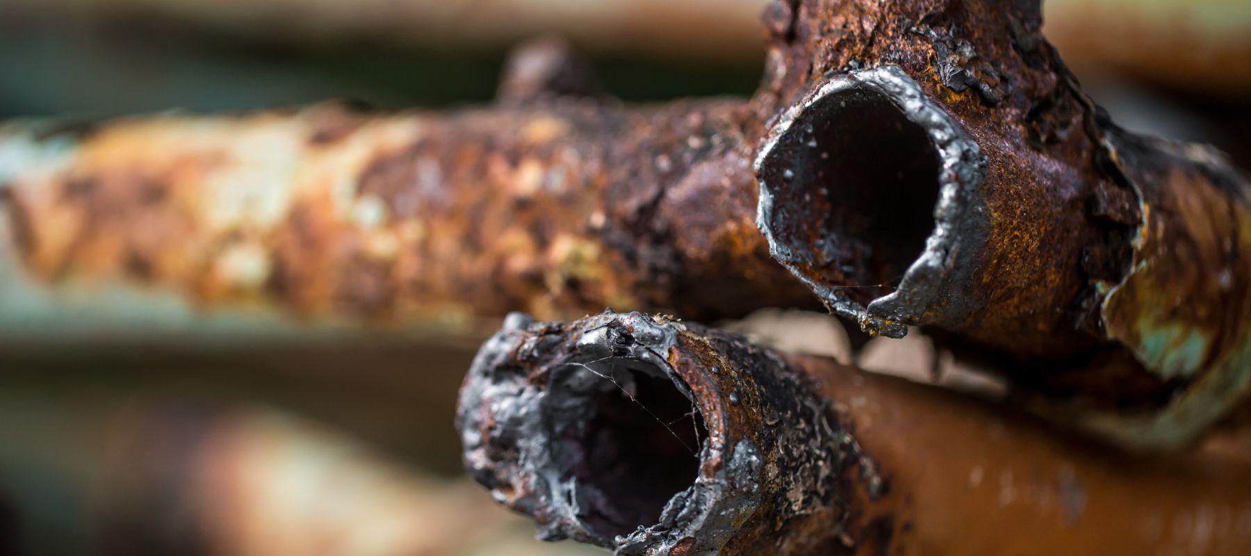 closeup of really rusted and broken pipes