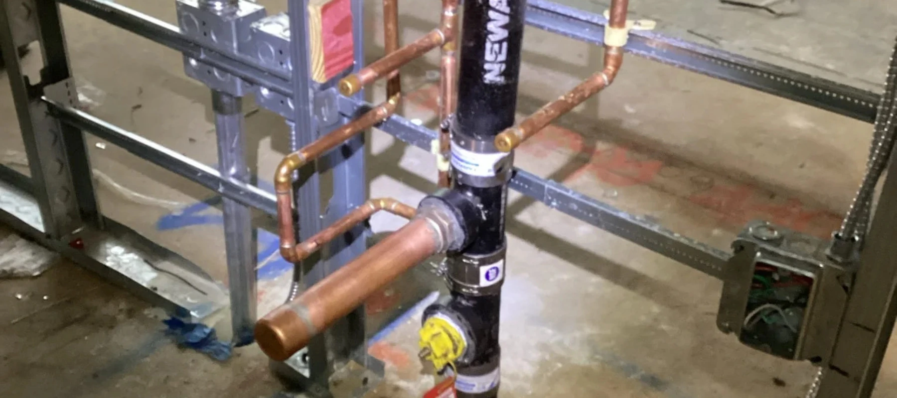 APT Law Office project plumbing installation with copper piping and valve connections