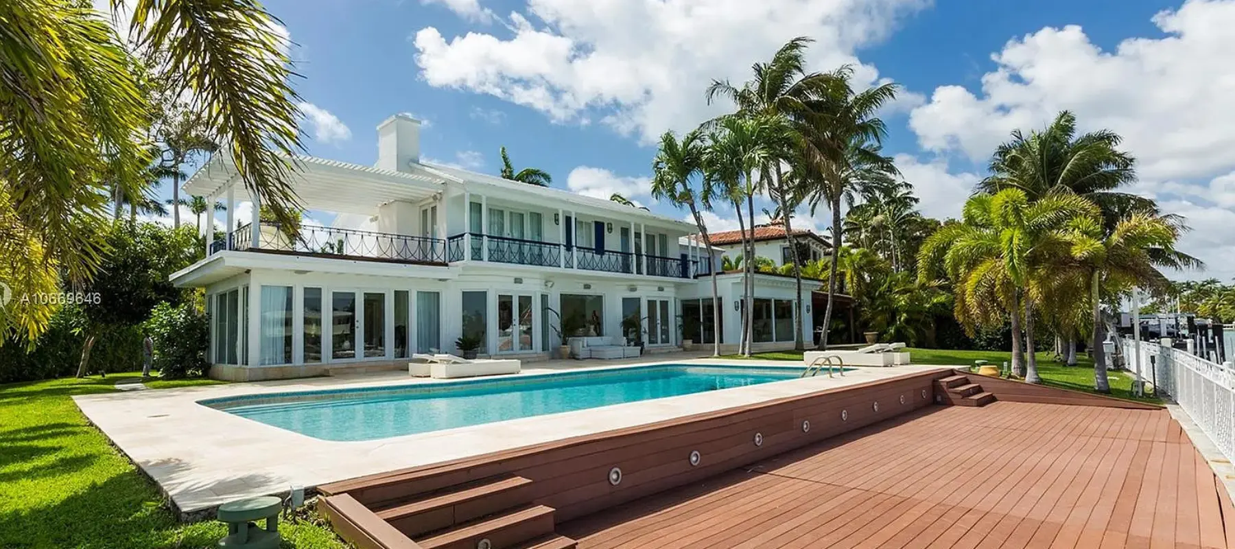 Lake House project in Miami Beach FL featuring luxury waterfront home with pool and outdoor living area